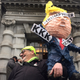 Photo of protestor outside the 9th U.S. Circuit Court of Appeals building in San Francisco on Thursday, Feb. 9, 2017 via AP